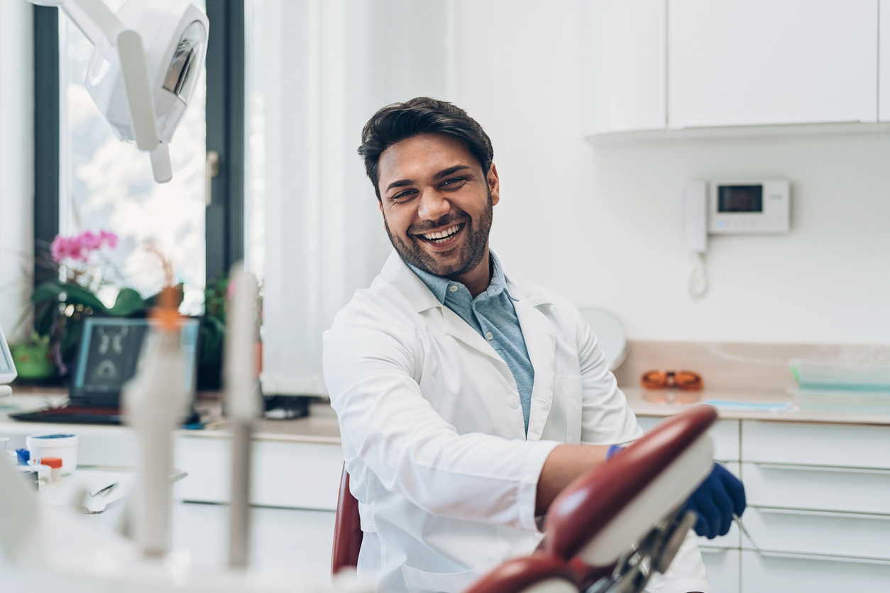 man in business casual shirt smiling